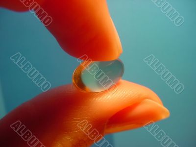 hand and capsule