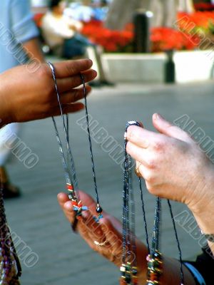 Closeup of Hands Holding Jewelry