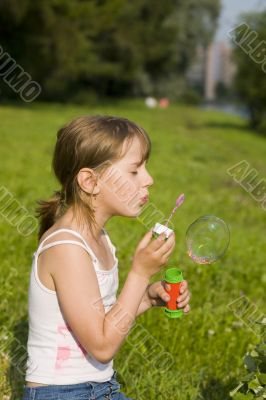 The girl and a soap bubble