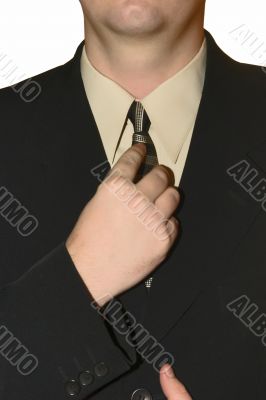 man in a black suit and tie
