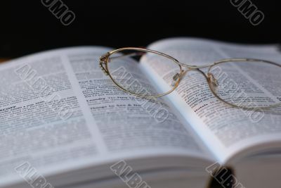 glasses on book page