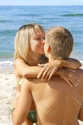 young loving couple on beach