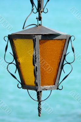 old lamp on sea background