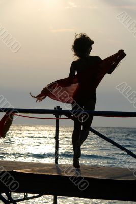 silhouette of women dancing with scarf