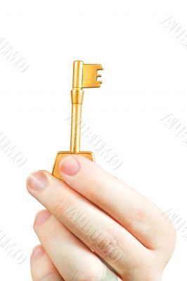 Hand holding a key of success