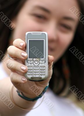 beautiful woman holding a cell phone