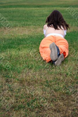 beautiful girl lying on the grass