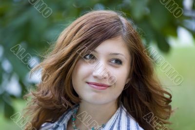 Beauty brunette in a park #1