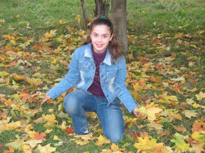 The young girl with yellow leaves