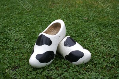 Wooden shoes with cow print.