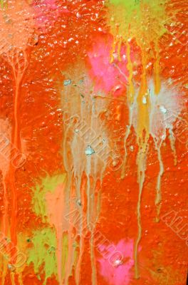 Multicolored blots and stains on wooden surface
