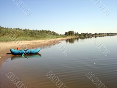 River landscape with pneumatic boat
