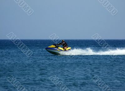 The men goes for a drive on a wave runner