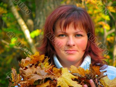 woman with autumn leaves