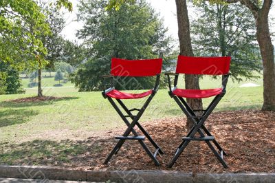 Two Red Chairs in Park