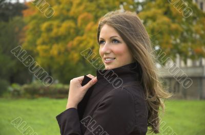 Portrait of the beautiful girl in autumn park