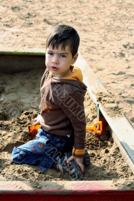 Boy in the sand-box