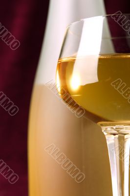 white wine in glass and bottle