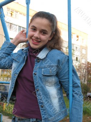 Smile young girl on a swing