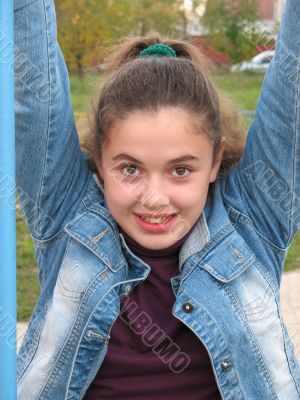 Smile beautiful girl on a swing