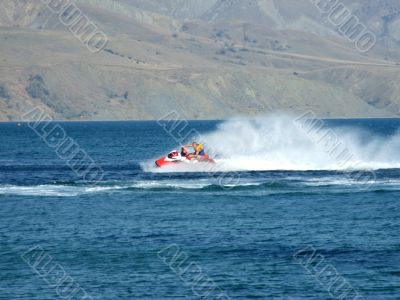 The men goes for a drive on a wave runner