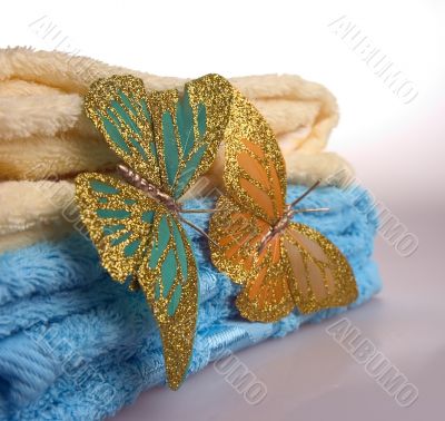 towels and beautiful artificial butterflies