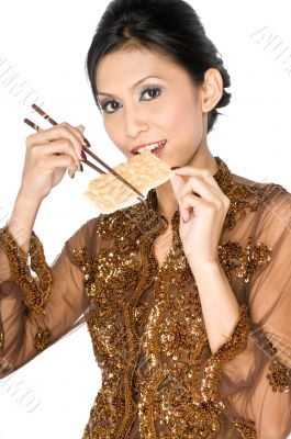 Eating healthy biscuit with chopsticks