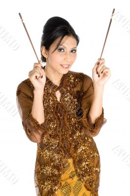 Beautiful asian girl playing with chopsticks