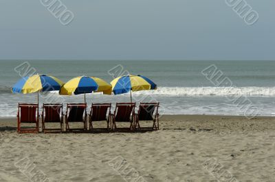 chaise lounges on pacific ocean
