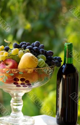 Bottle of red wine with fruit