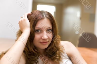 Smiling pretty brunette in a room #2