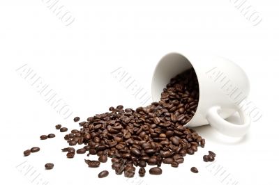 spilt coffee beans isolated on white