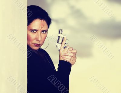 Hispanic Woman with Handgun