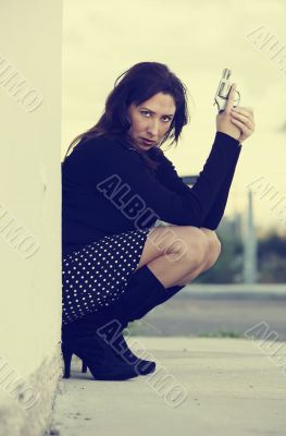 Hispanic Woman with Handgun