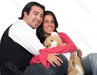 happy casual couple with teddy
