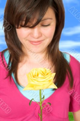 beautiful teenager with a yellow rose