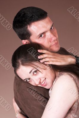 beautiful couple in love over brown