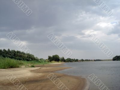 River landscape before thunderstorm