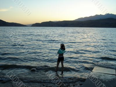 The sea, mountain, sunset and a girl