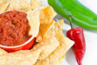 salsa and chips with peppers