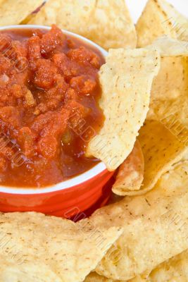 closeup of chip in salsa