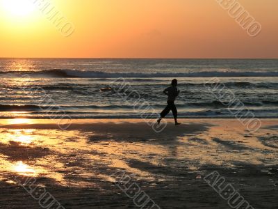 Man running alone on the beach