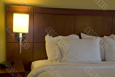 Corner of bed and pillows