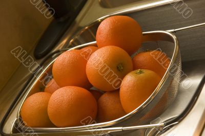 Oranges in Strainer