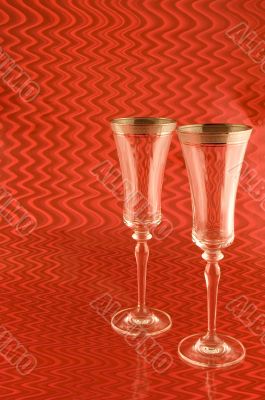 Two Champagne Glasses on Red Background