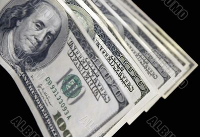 unfocused US dollars on a black background
