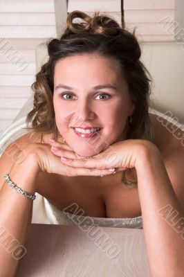 Leaning on her hands