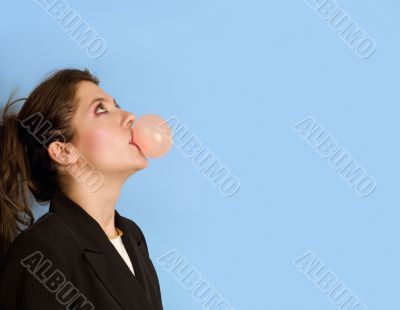 girl looking up while bowling in a sticky gum