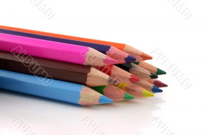 Stack of colored pencils on a white background