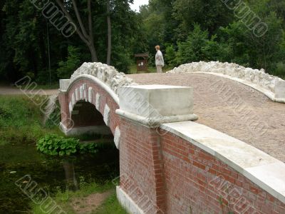 The stone bridge on a pond